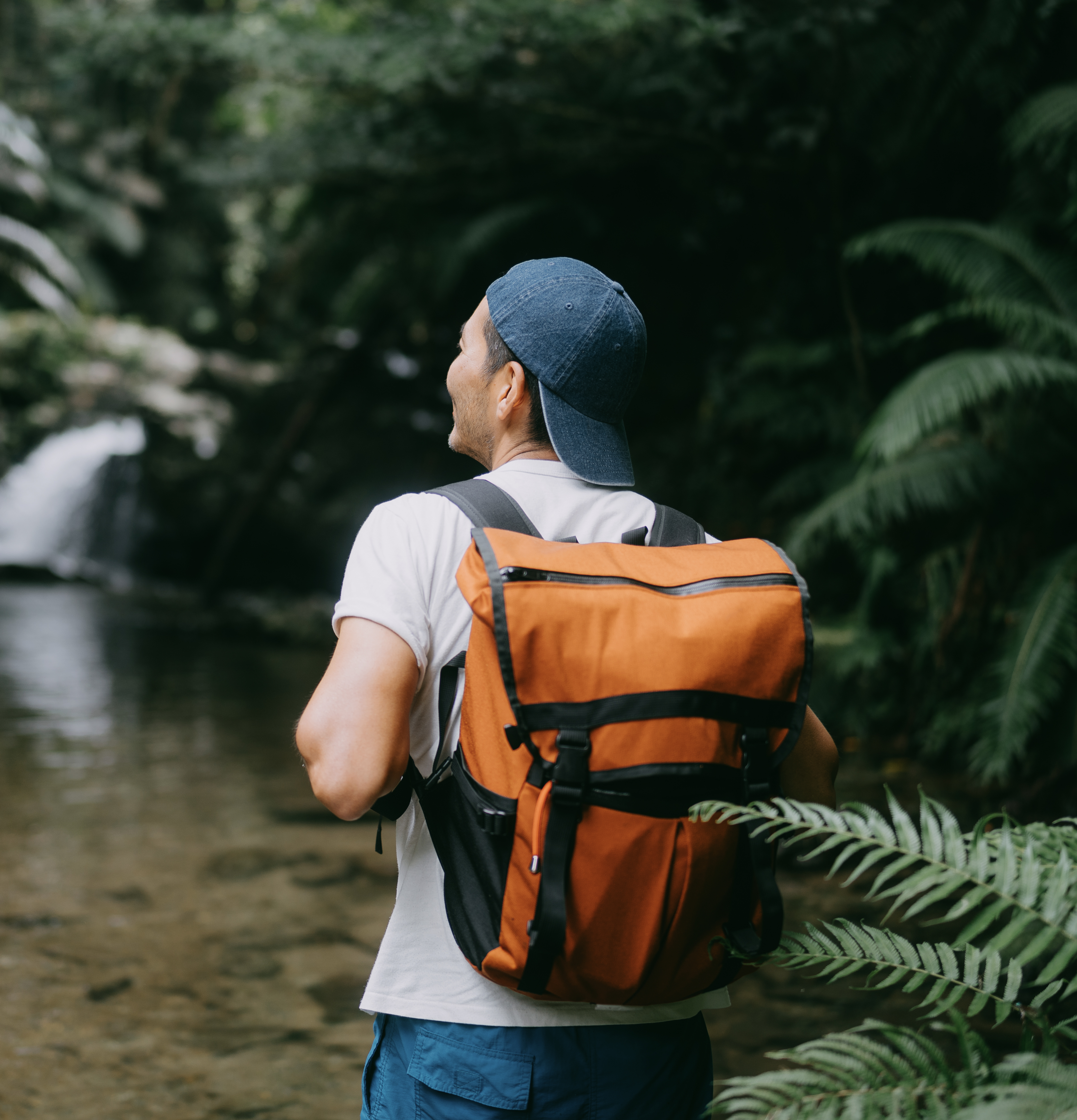 Man hiking through jungle river